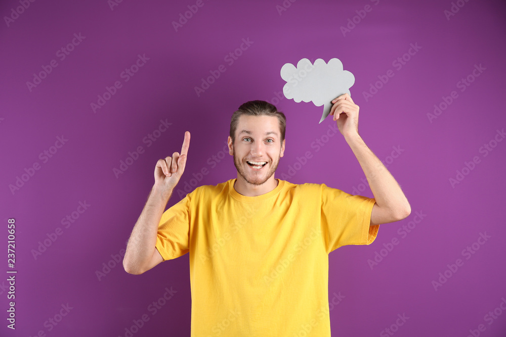 Young man with blank speech bubble on color background