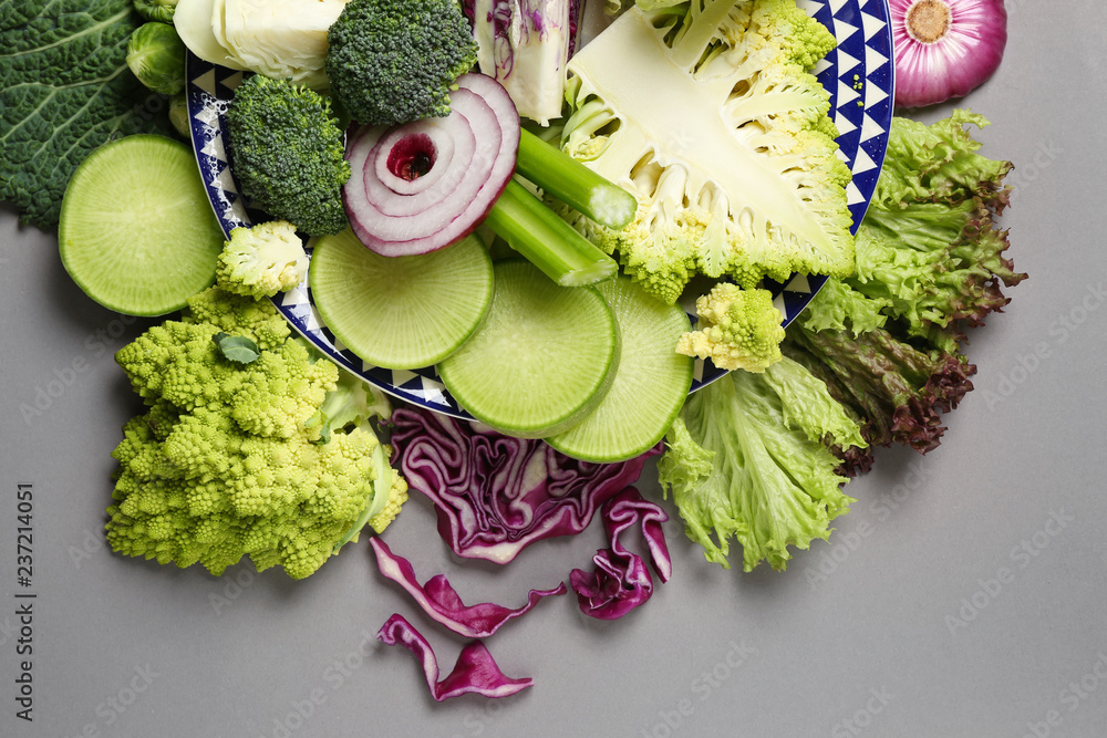 Different fresh vegetables on grey background