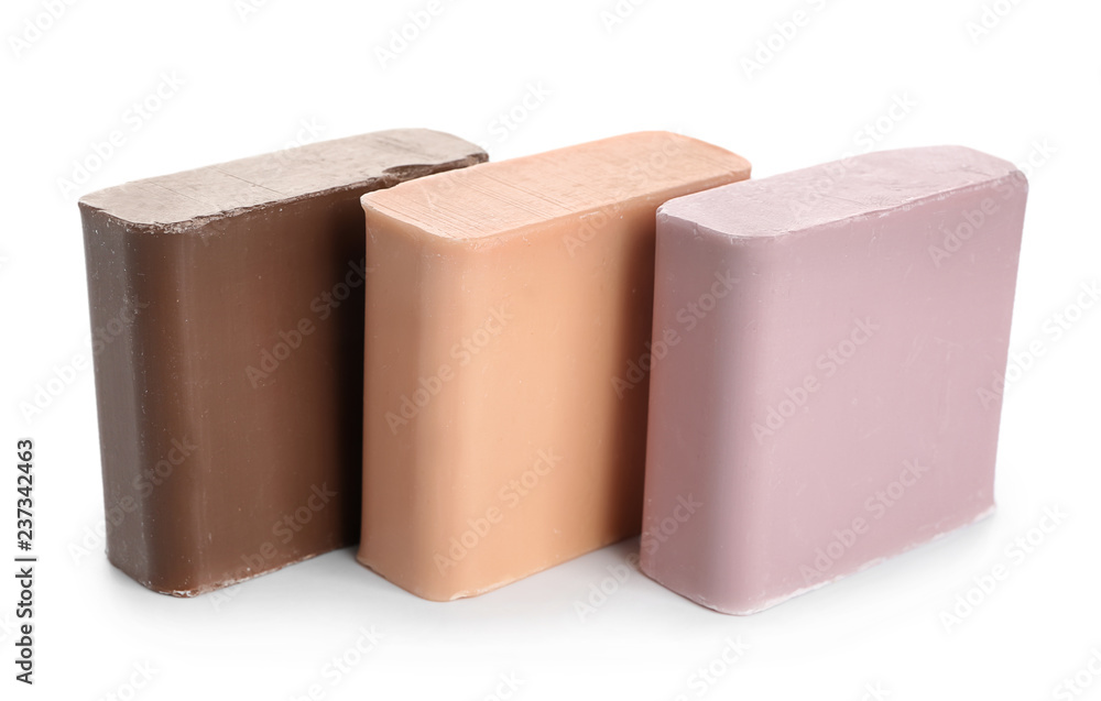 Different soap bars on white background