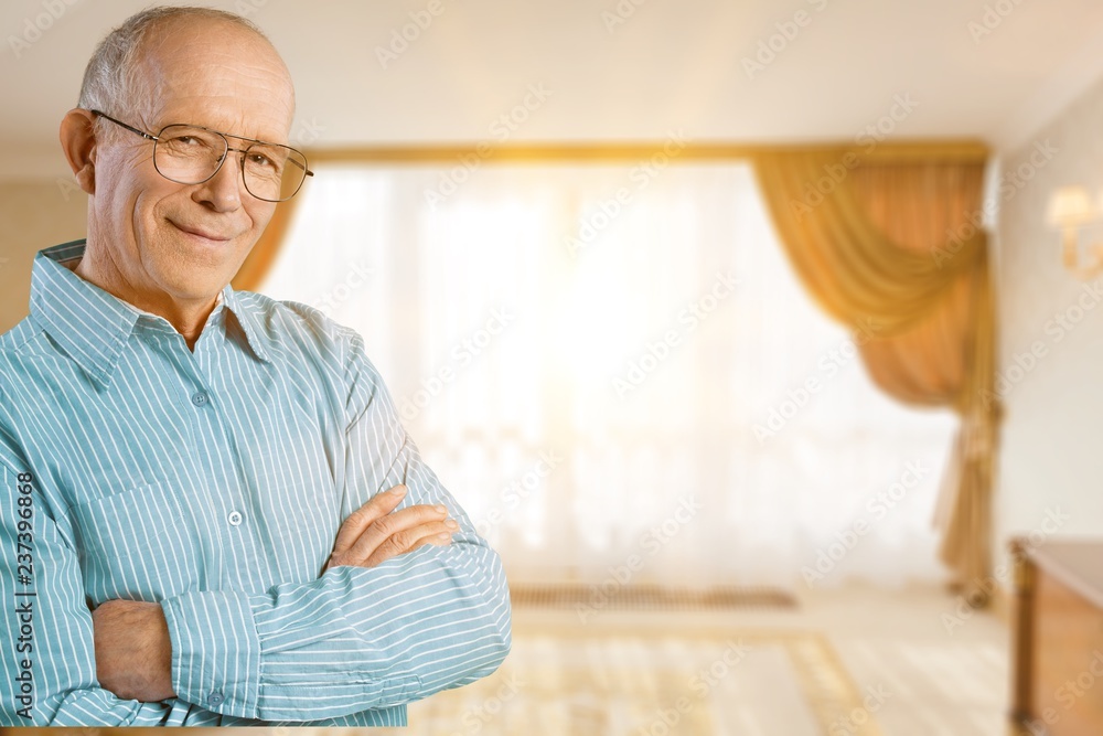 Happy senior man in blue shirt