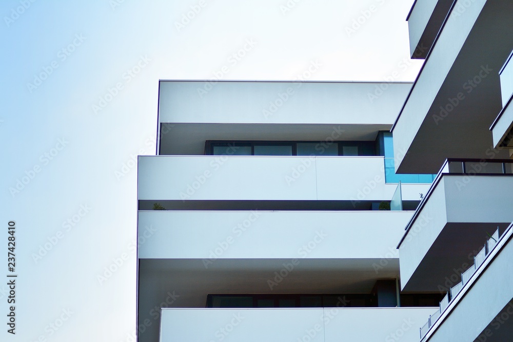 Modern apartment buildings on a sunny day with a blue sky. Facade of a modern apartment building