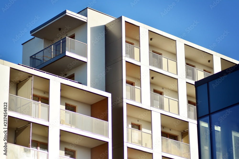 Modern apartment buildings on a sunny day with a blue sky. Facade of a modern apartment building