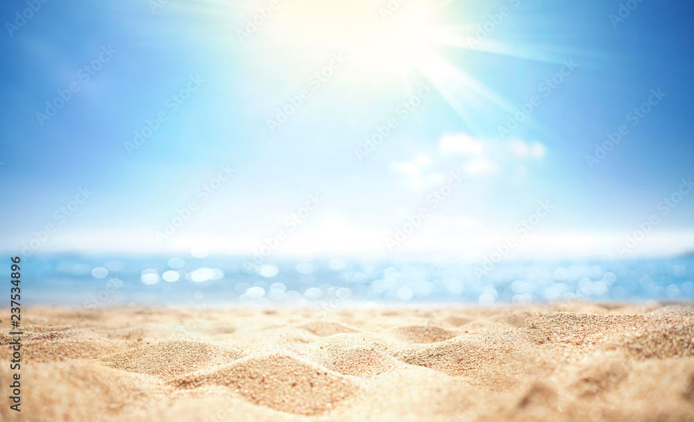 Abstract blur defocused background, nature of tropical summer beach with rays of sun light. Golden s