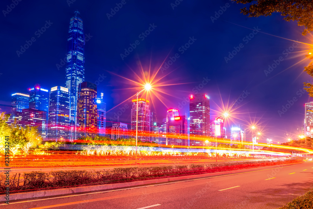 In the evening, there are blurred traffic lights on Chinese roads...