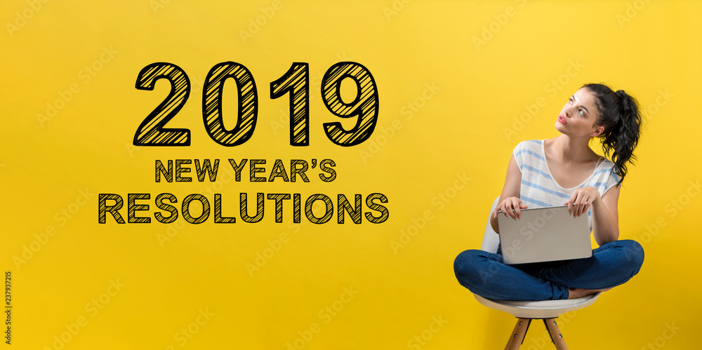 2019 New Years Resolutions with young woman using a laptop computer 