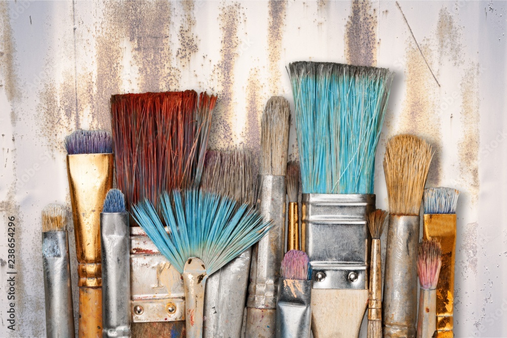 Artist paint brushes and paint cans