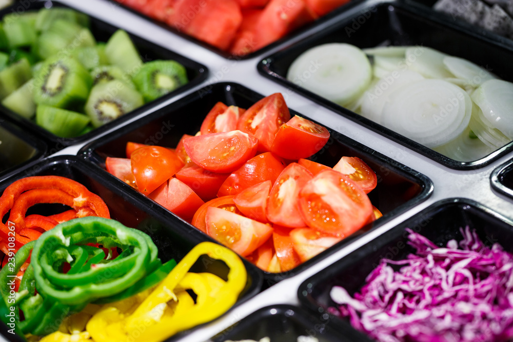 Fresh Vegetables and Fruits sliced in Salad Bar buffet