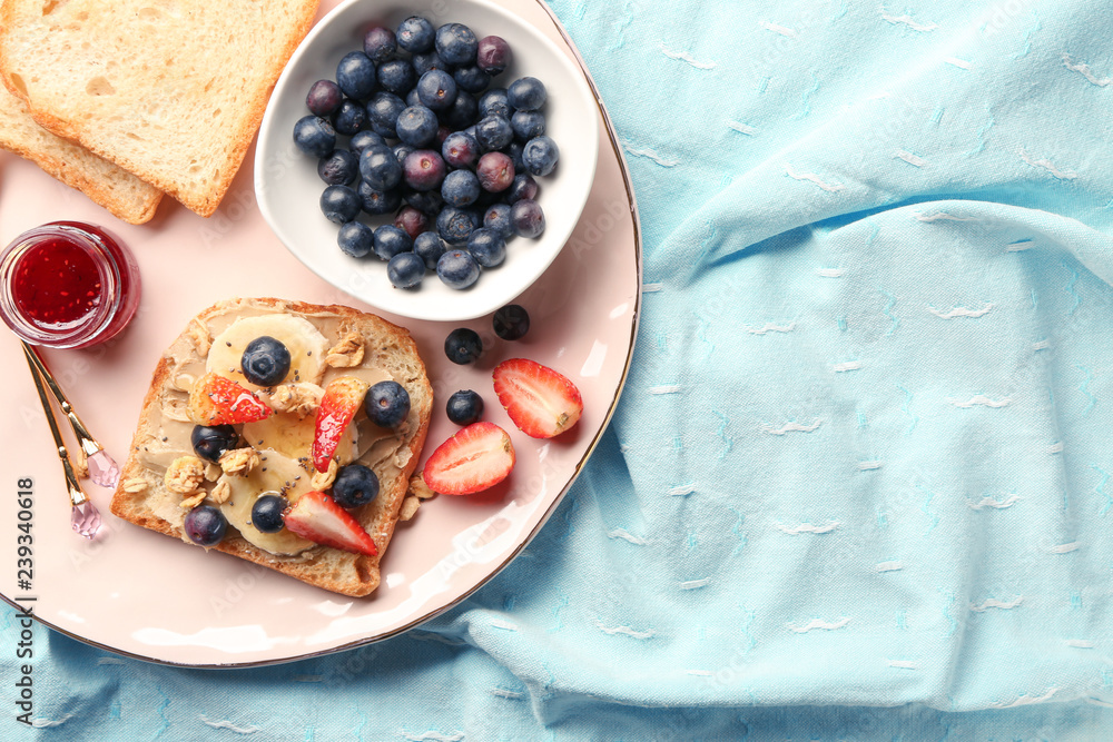 Toasted bread with berries and fruit on plate