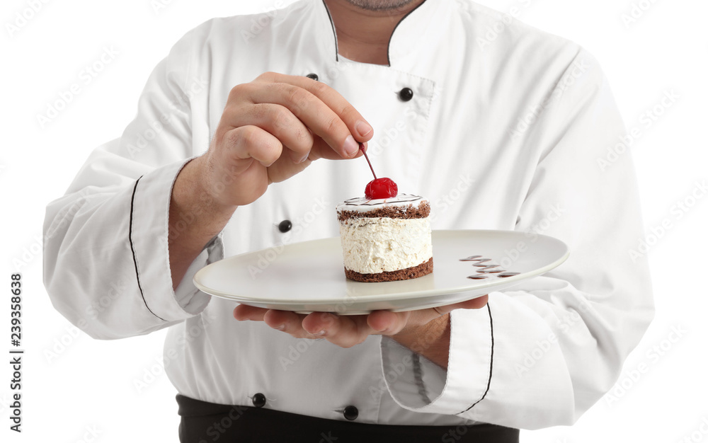 Male chef with tasty dessert on white background, closeup