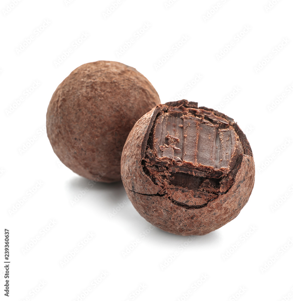 Tasty chocolate truffles on white background