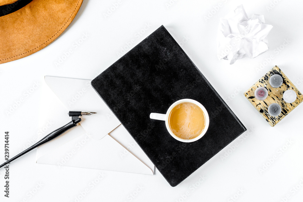 Writer workplace with tools on white background top view