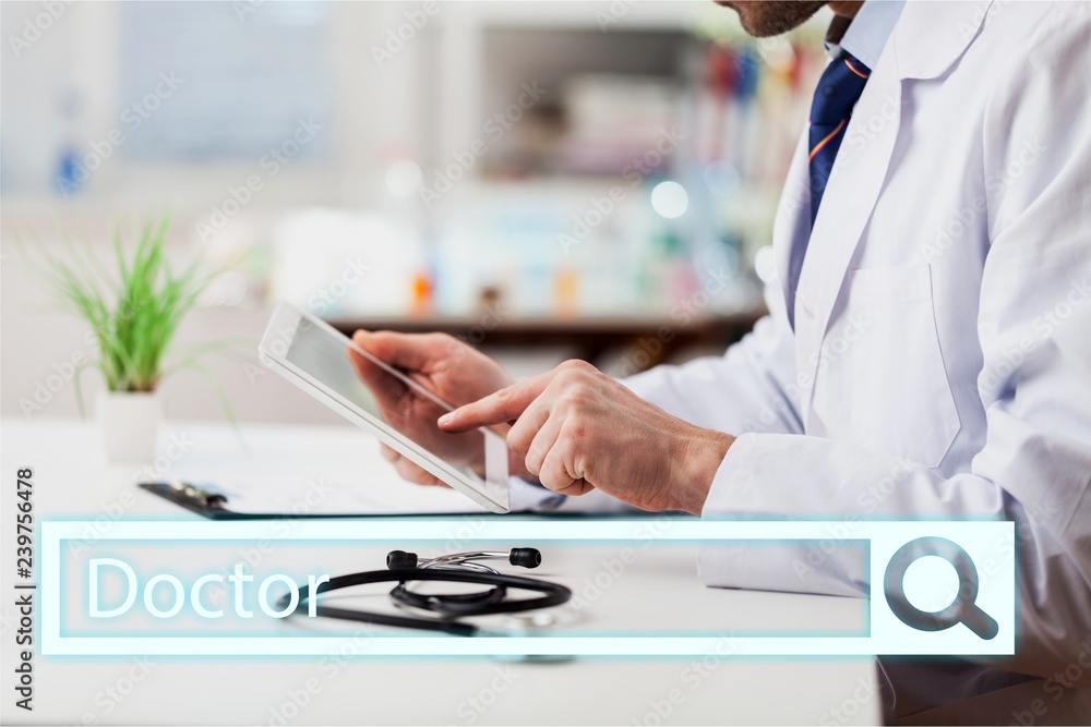 Close-up Doctor at hospital working with tablet pc