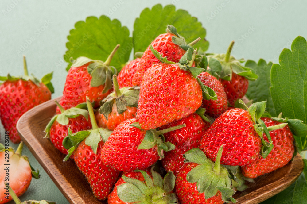 A beautiful and delicious strawberries set isolated on colorful background, close up, macro, copy sp