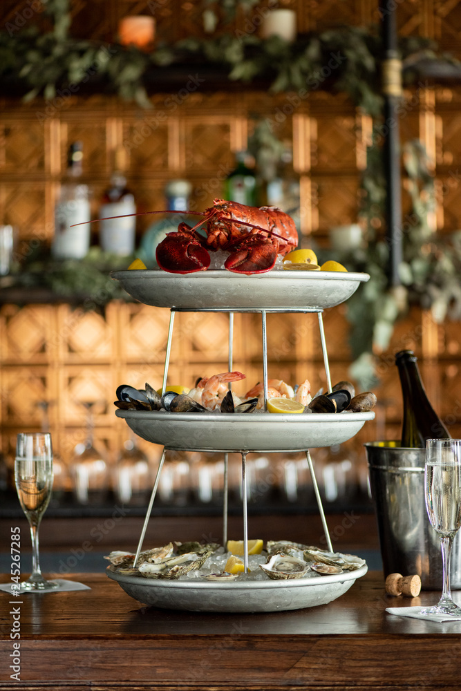 seafood tower with whole lobster in restaurant