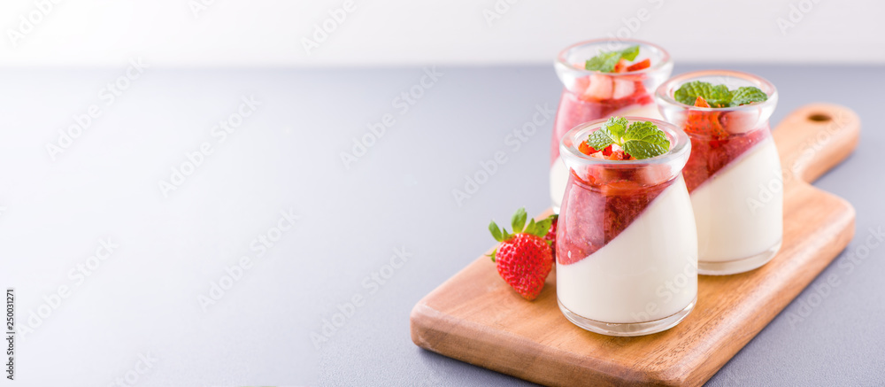 Delicous and nutritious double color (colour) strawberry desserts with mint and diced sarcocarp topp