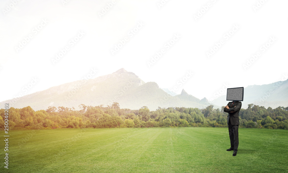 Businessman with TV instead of head.