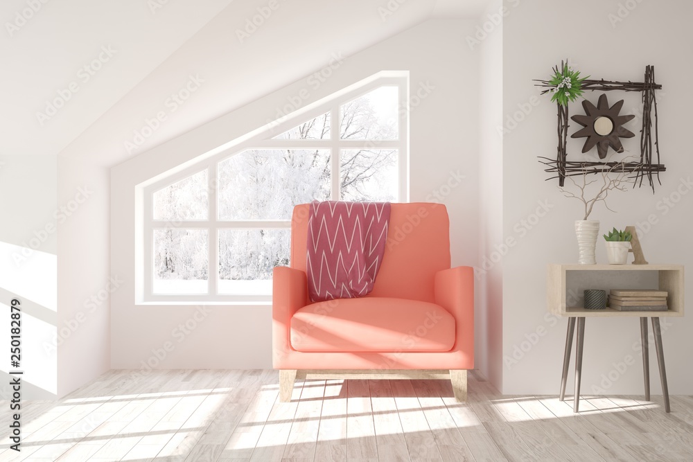 White stylish minimalist room with coral armchair and winter landscape in window. Scandinavian inter