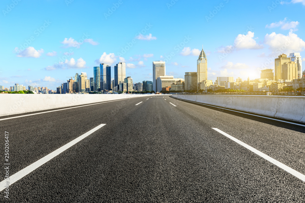 Empty asphalt road through the Shanghai Bund business district