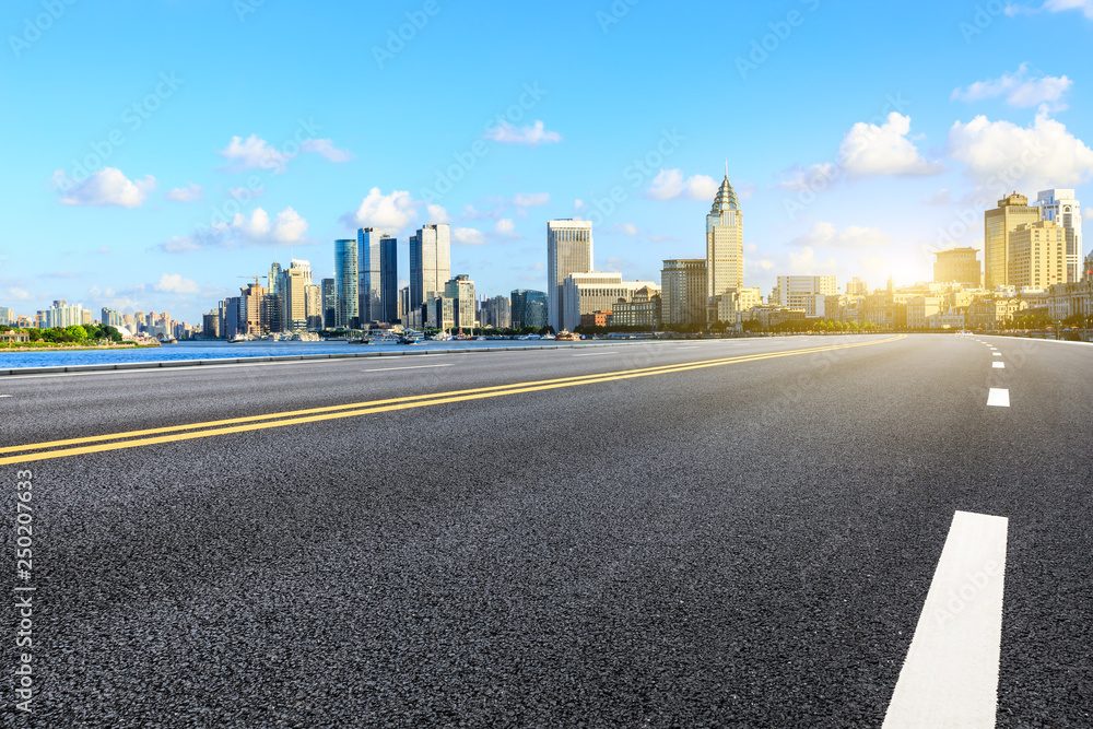 Empty asphalt road through the Shanghai Bund business district