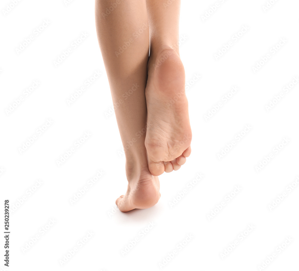 Legs of young woman with beautiful pedicure on white background