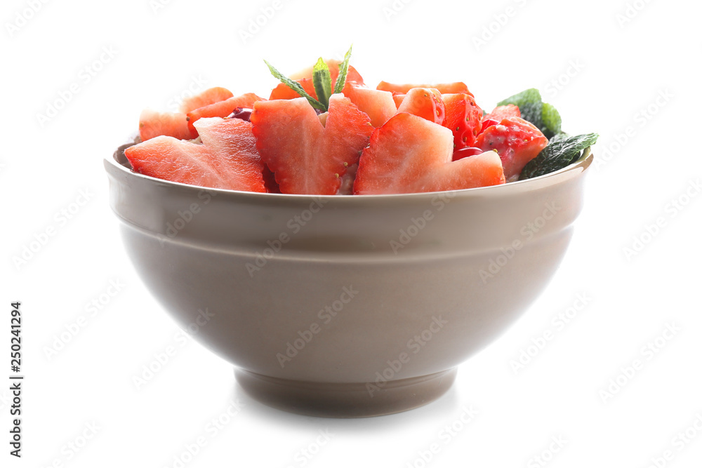 Bowl with tasty oatmeal on white background