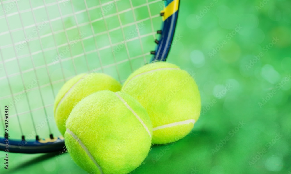 Tennis game. Tennis balls and rackets on  background.