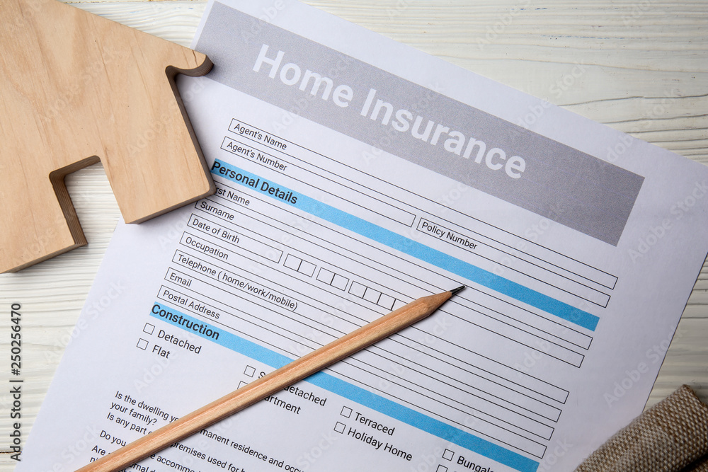 Home insurance form on white table