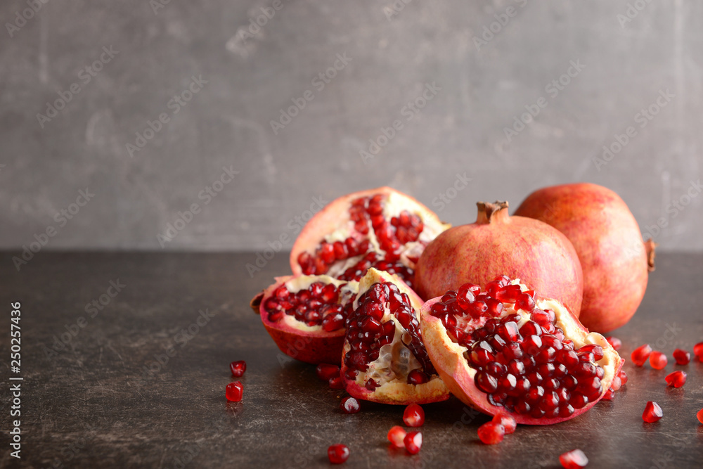 Ripe pomegranates on table