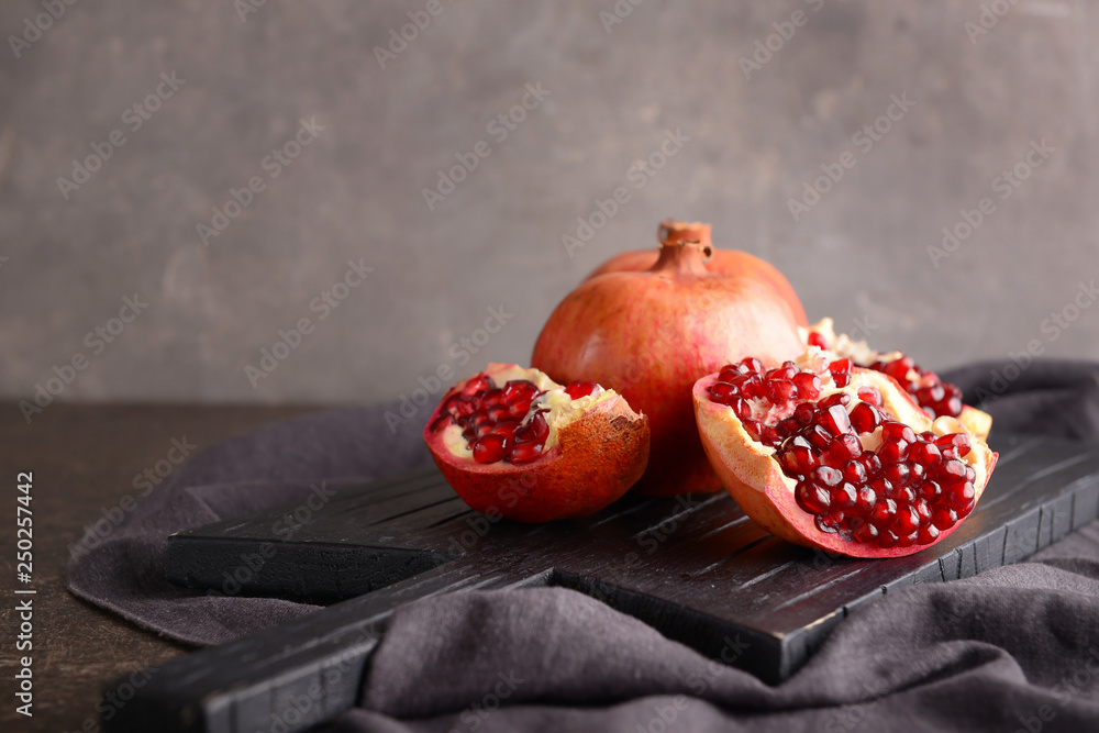 Ripe pomegranates on table