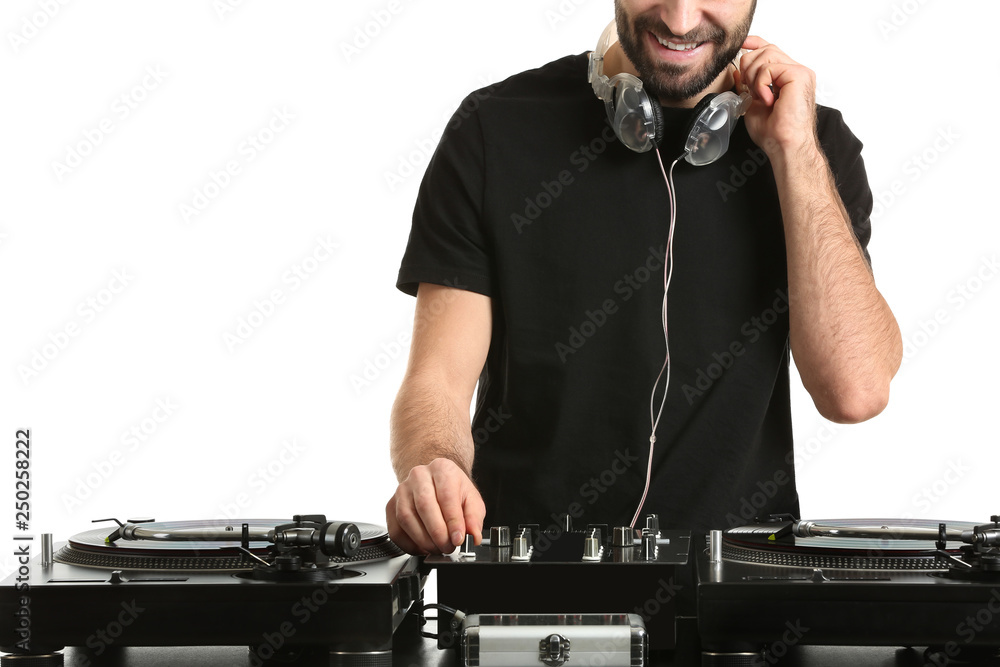 Male DJ playing music on white background