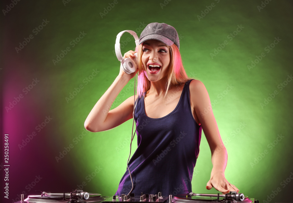 Female DJ playing music in club