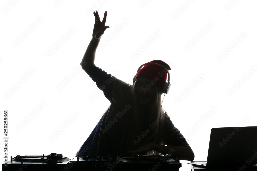 Silhouette of female DJ playing music on white background