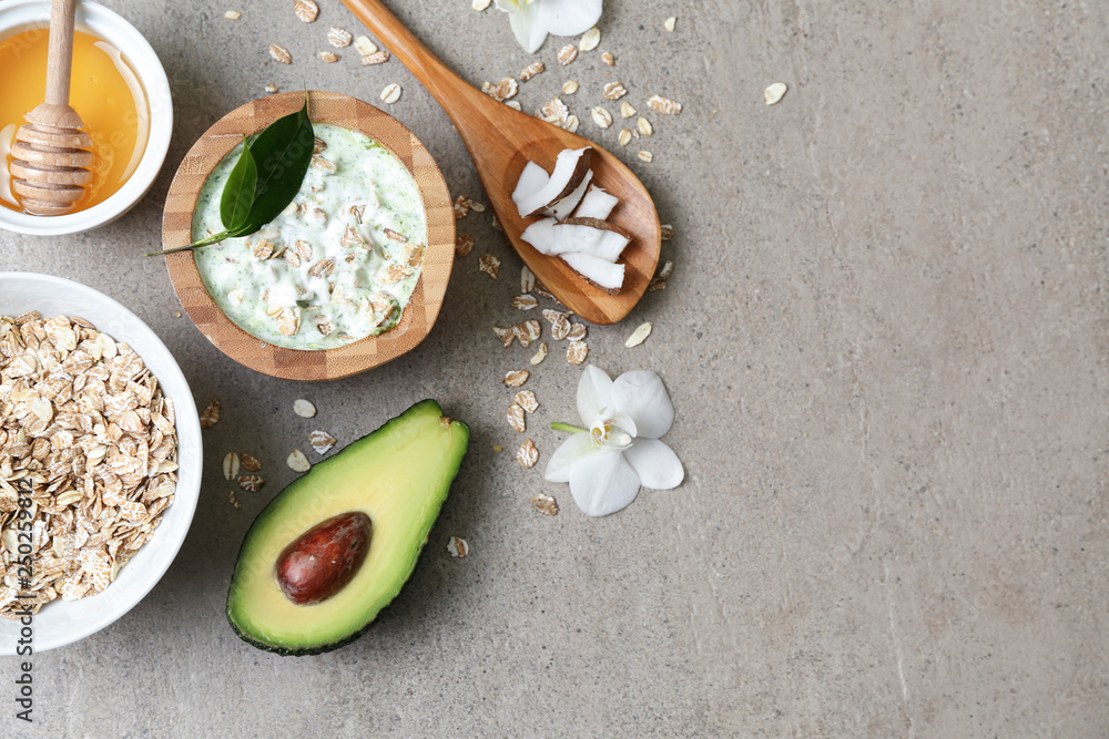 Natural ingredients for cosmetic on grey background