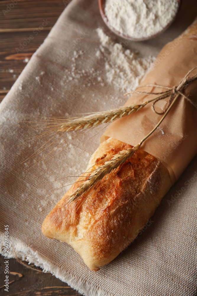 Loaf of fresh bread on table