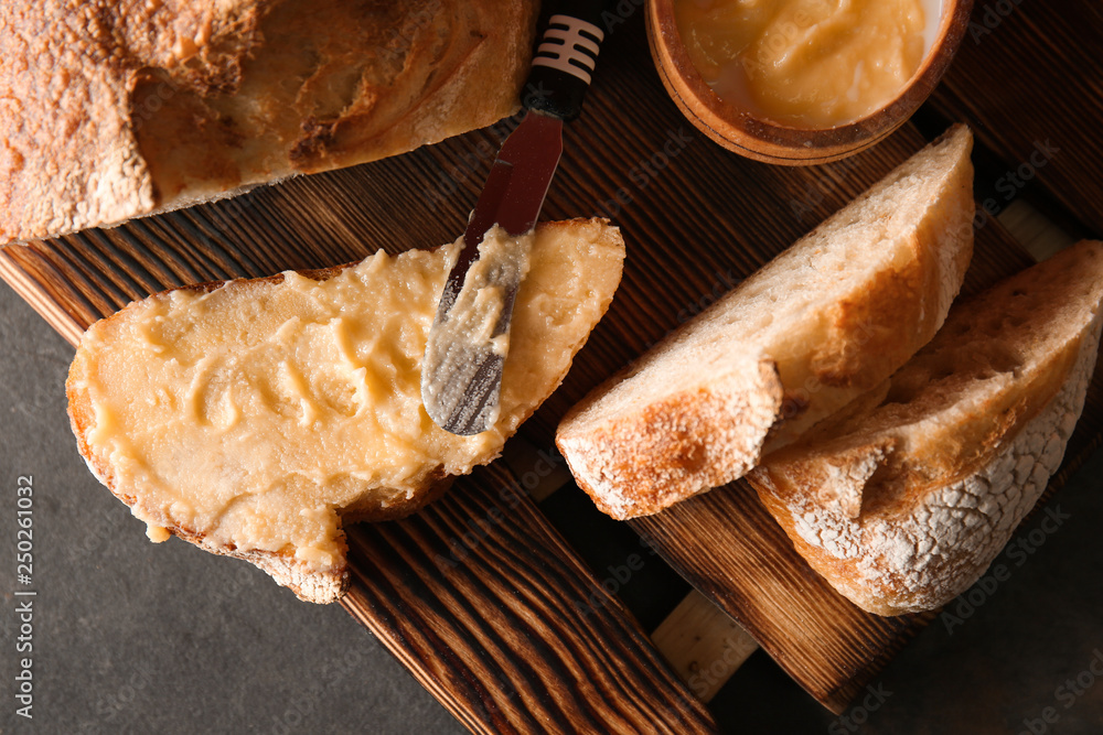 Cut bread with spreading on table