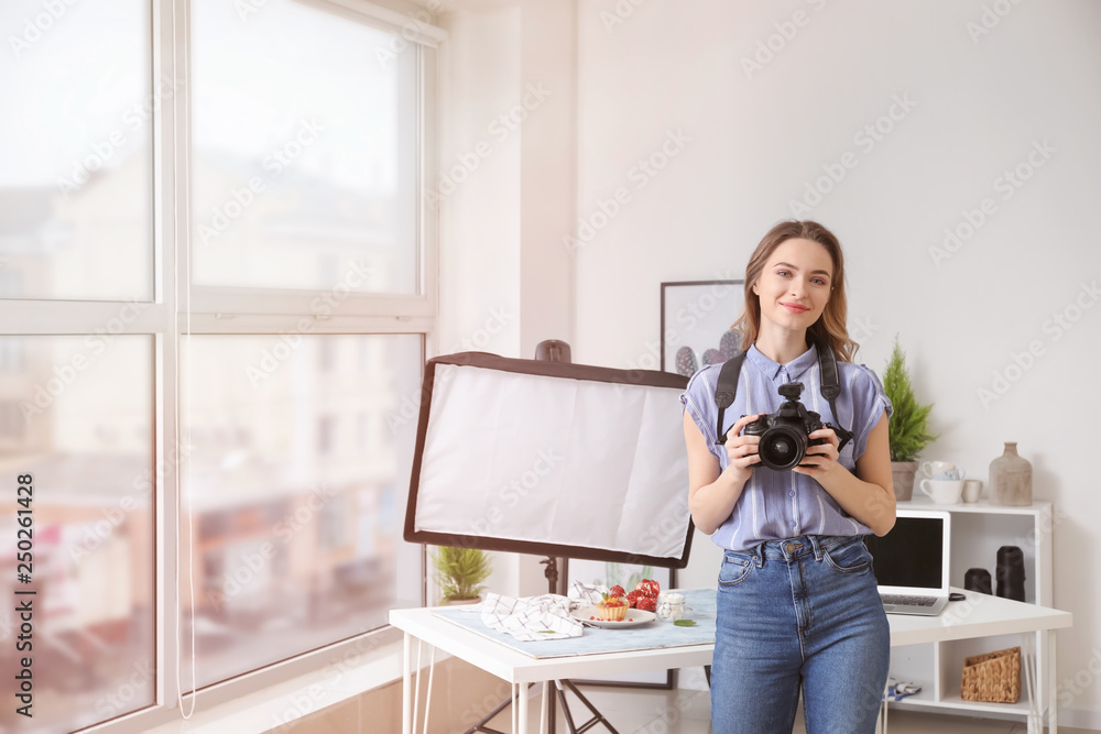 Portrait of female food photographer in home studio