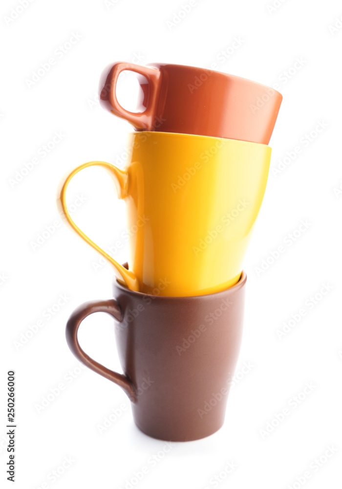 Colorful empty cups on white background