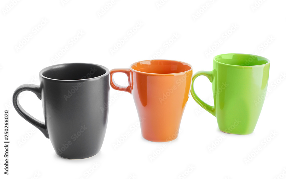 Colorful empty cups on white background