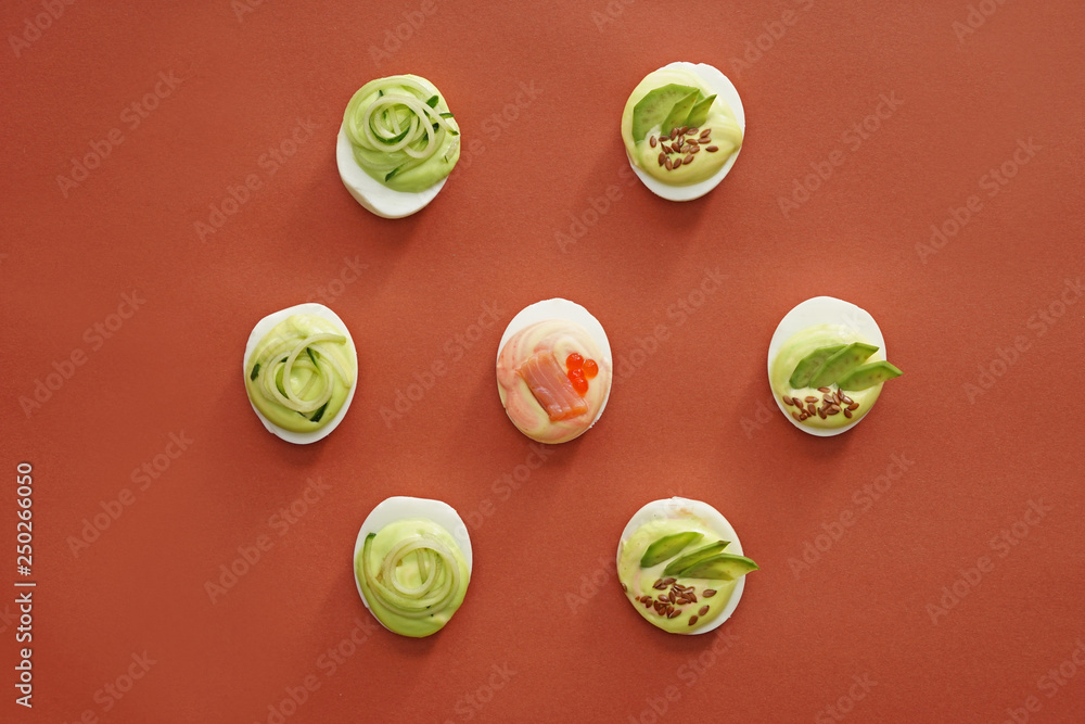 Tasty deviled eggs on color background