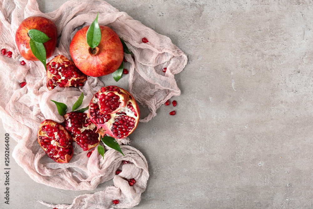 Tasty ripe pomegranates on table