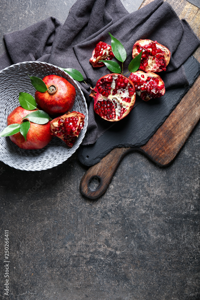 Tasty ripe pomegranates on table