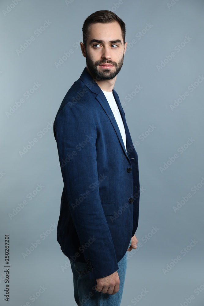 Handsome fashionable man on grey background