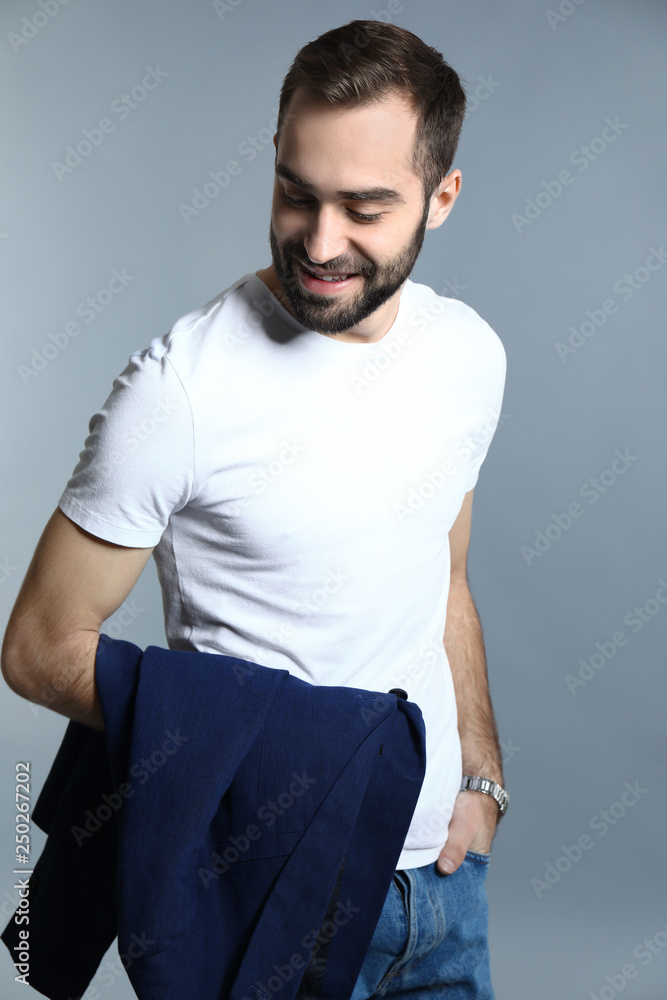 Handsome fashionable man on grey background