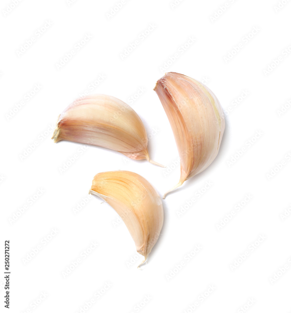 Garlic cloves on white background