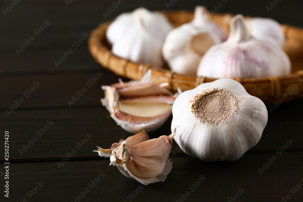 Fresh garlic on wooden background