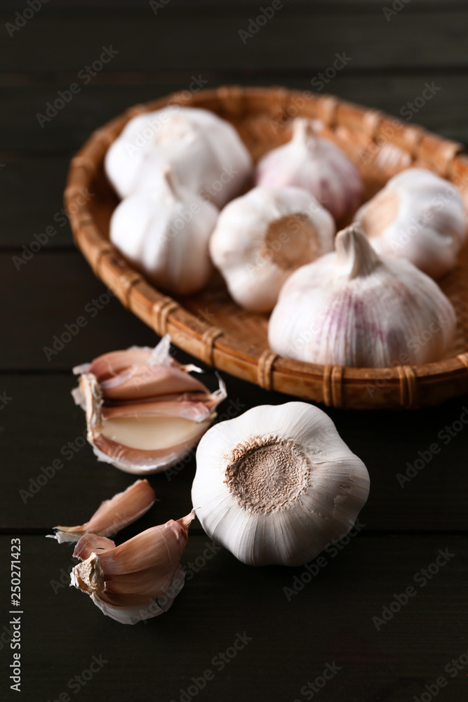 Fresh garlic on wooden background