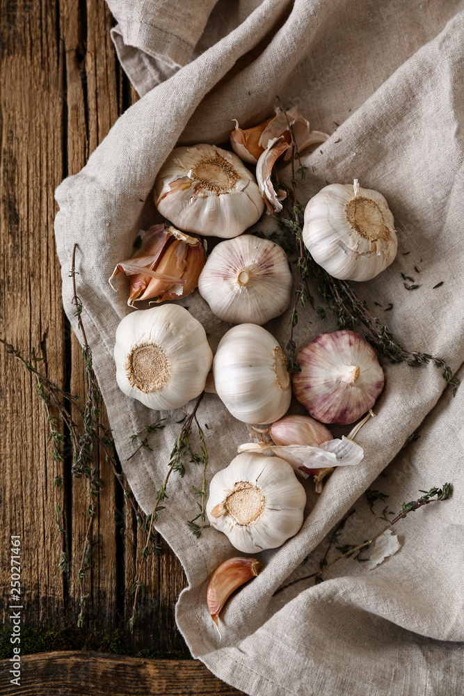 Fresh garlic on wooden background