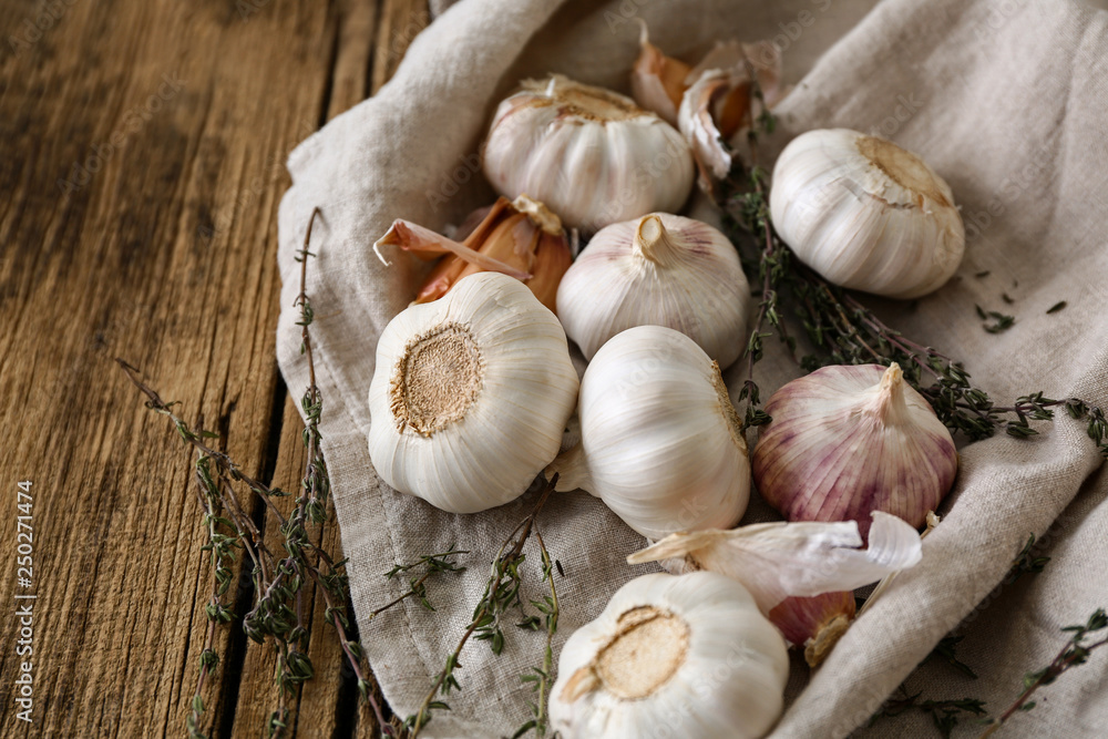 Fresh garlic on wooden background