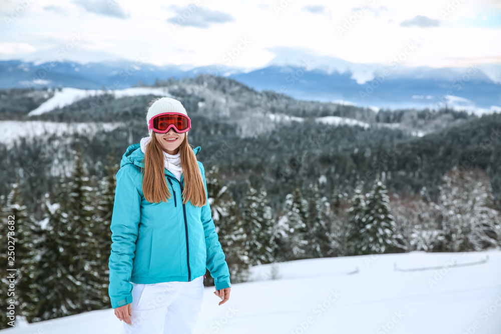 Sporty young woman at winter resort