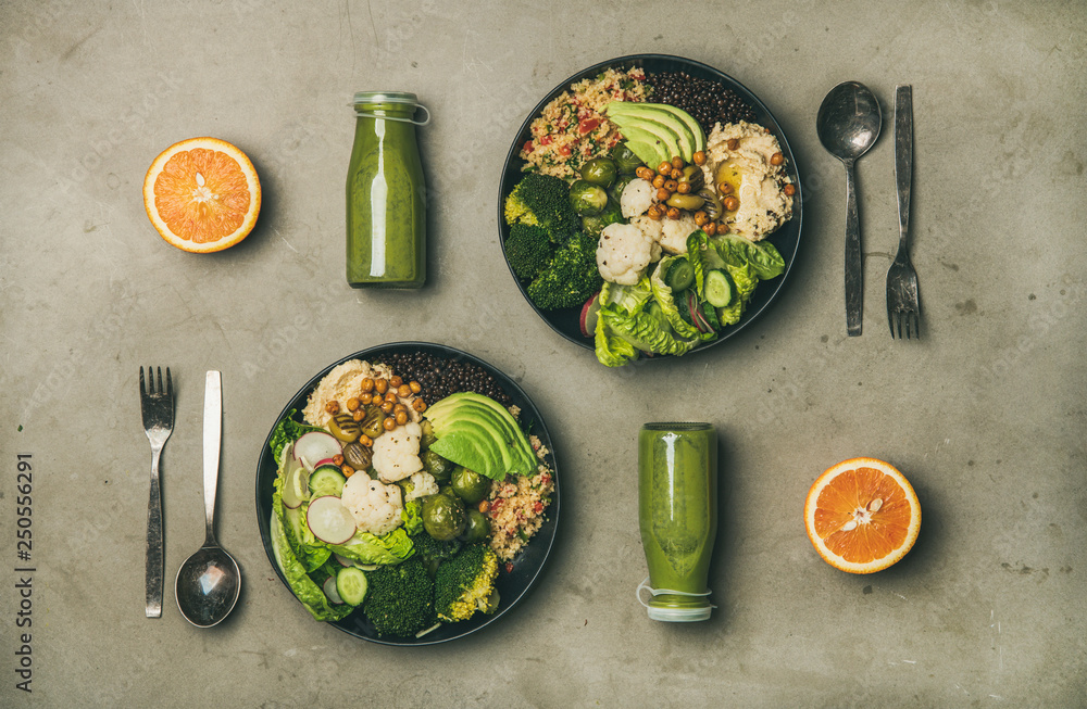 Healthy dinner or lunch setting. Flat-lay of vegan superbowls or Buddha bowls with hummus, vegetable